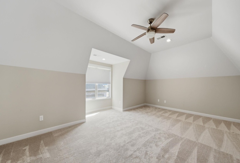 Bonus room featuring lofted ceiling, light carpet, a ceiling fan, and recessed lighting