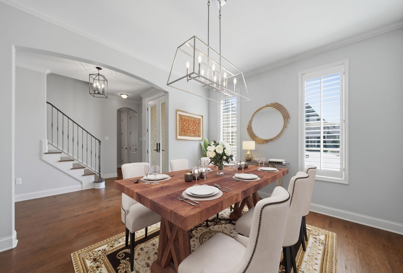 Dining area with arched walkways, crown molding, dark wood-style floors, and a chandelier