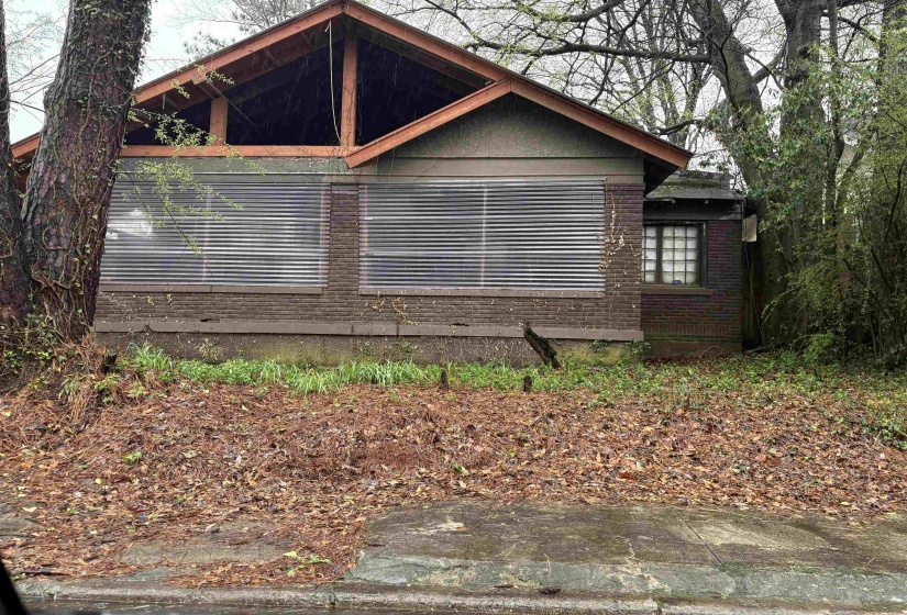 View of side of home with brick siding