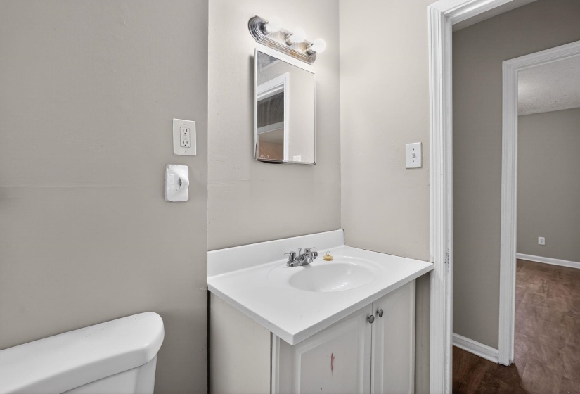 Bathroom with vanity and dark wood finished floors