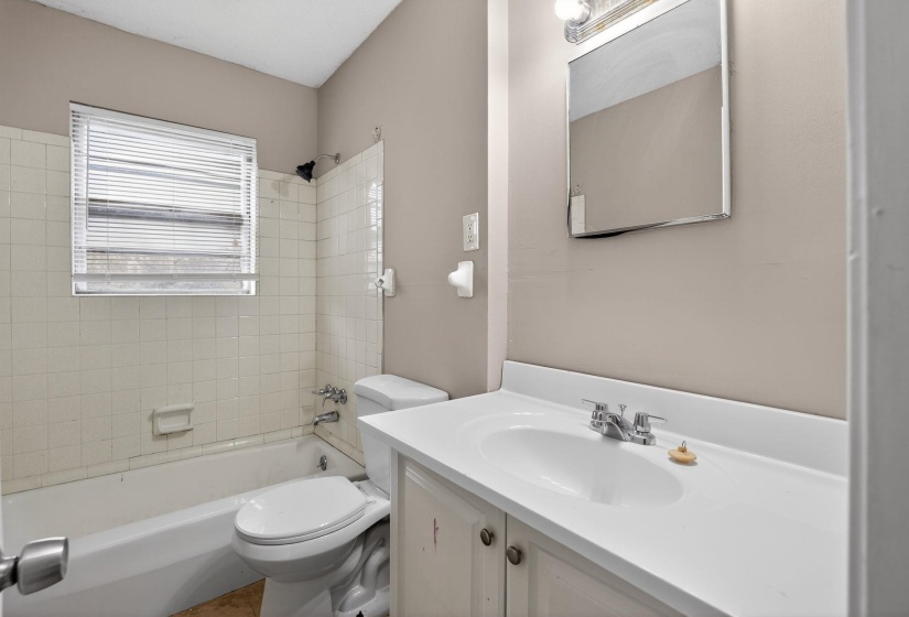 Bathroom featuring vanity and bathtub / shower combination