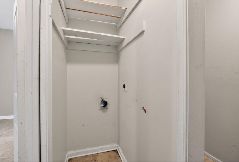 Laundry area with baseboards and electric dryer hookup