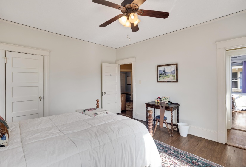 Bedroom featuring dark wood finished floors and ceiling fan