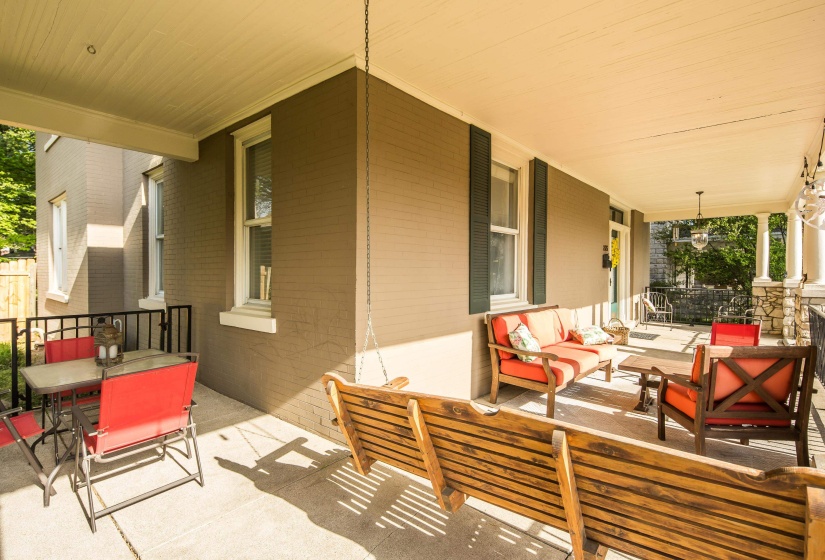 Covered porch with outdoor dining area