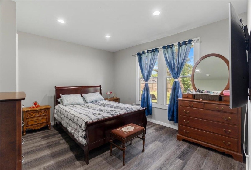 Bedroom with recessed lighting and wood finished floors
