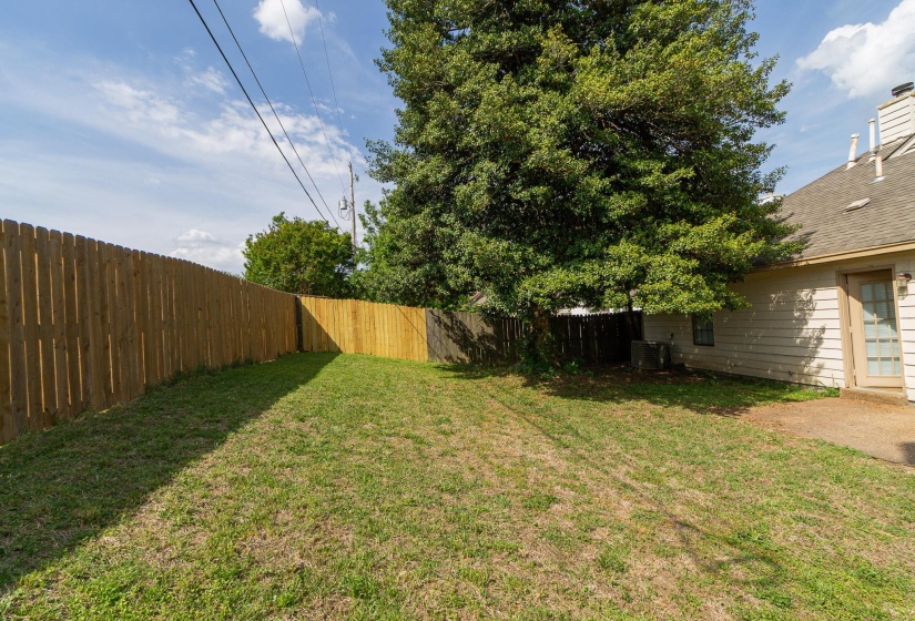 View of fenced backyard