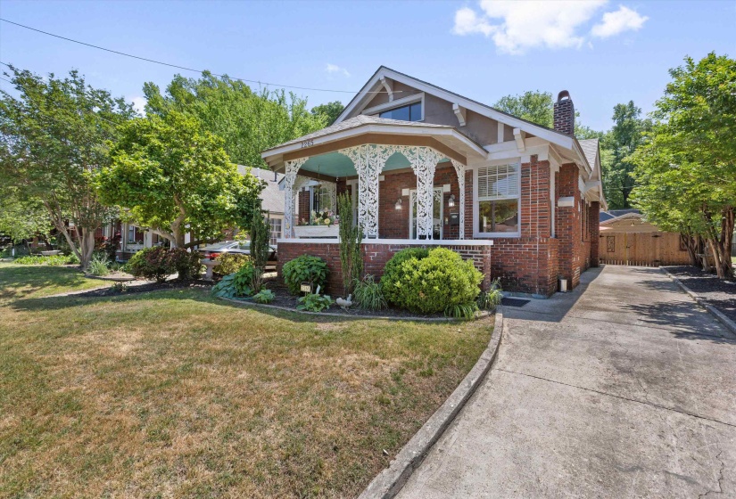 West side with drive and wood privacy fence