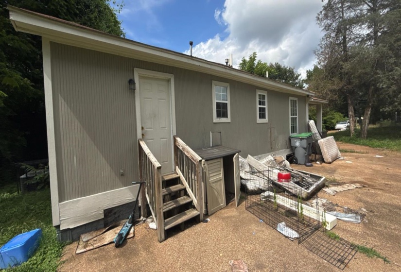 Rear view of house featuring entry steps