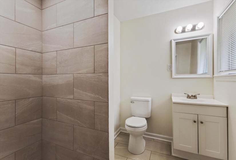 Bathroom featuring toilet and vanity