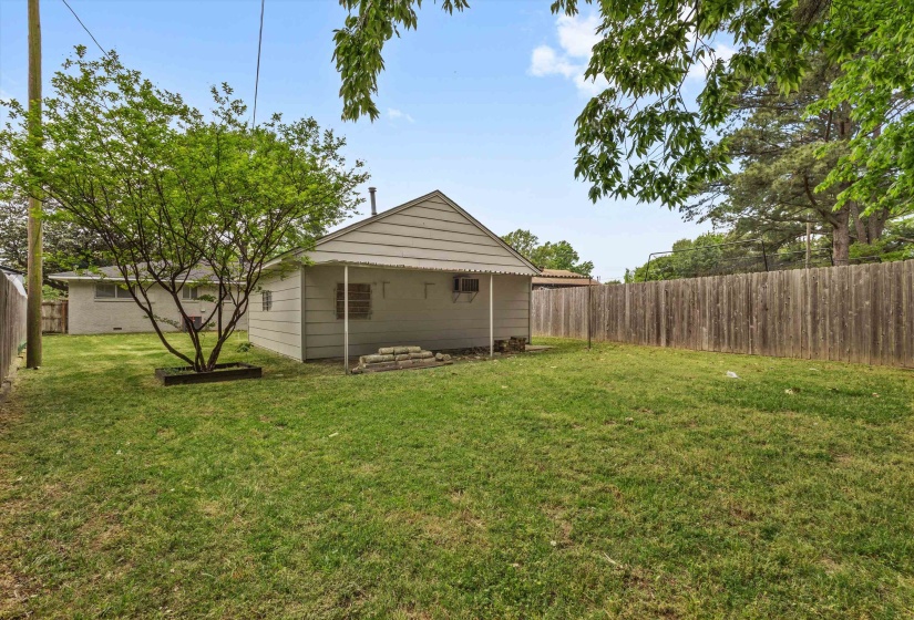 View of fenced backyard