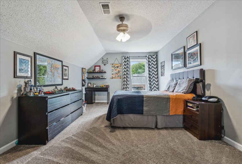 Bedroom featuring carpet and ceiling fan