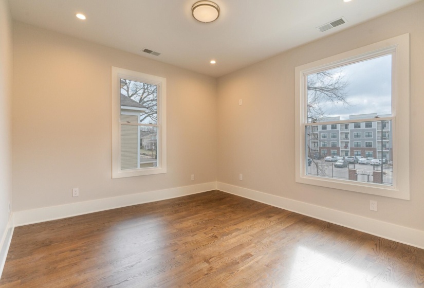 Spare room with recessed lighting and wood finished floors