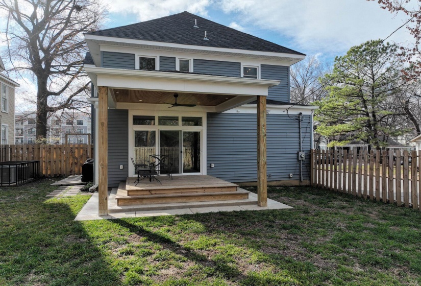 Rear view of house featuring a ceiling fan, a fenced backyard, roof with shingles, and a wooden deck
