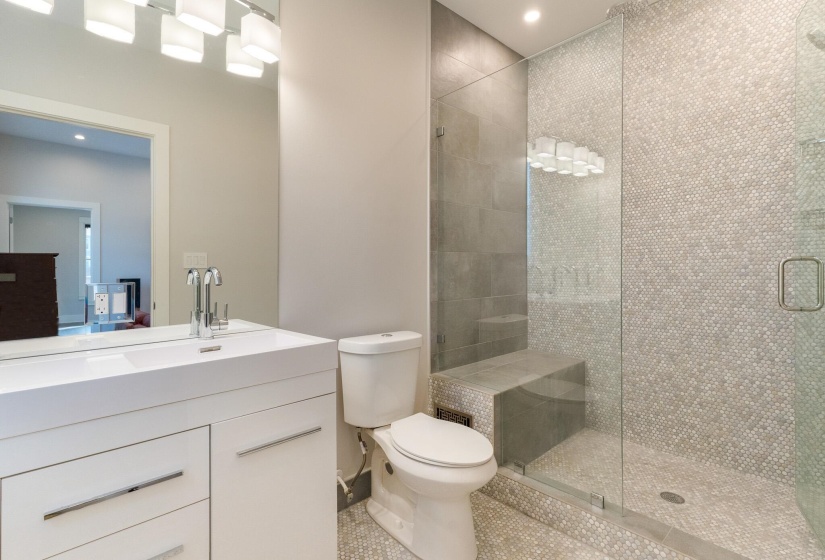 Full bathroom with a shower stall, vanity, recessed lighting, and light tile patterned floors