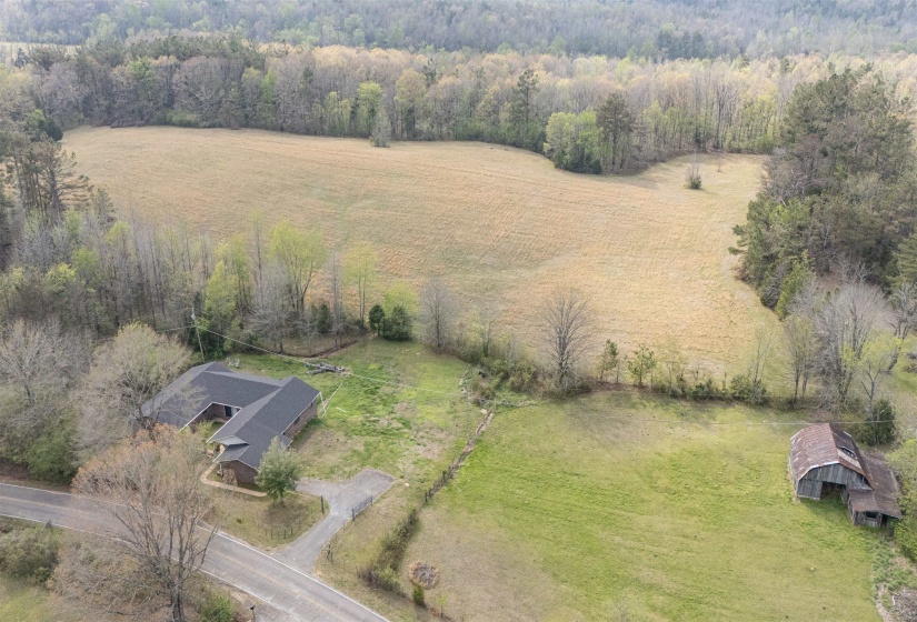 Aerial view of sparsely populated area featuring a forest