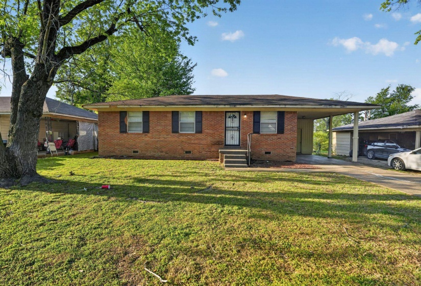Single story home featuring crawl space, an attached carport, and brick siding