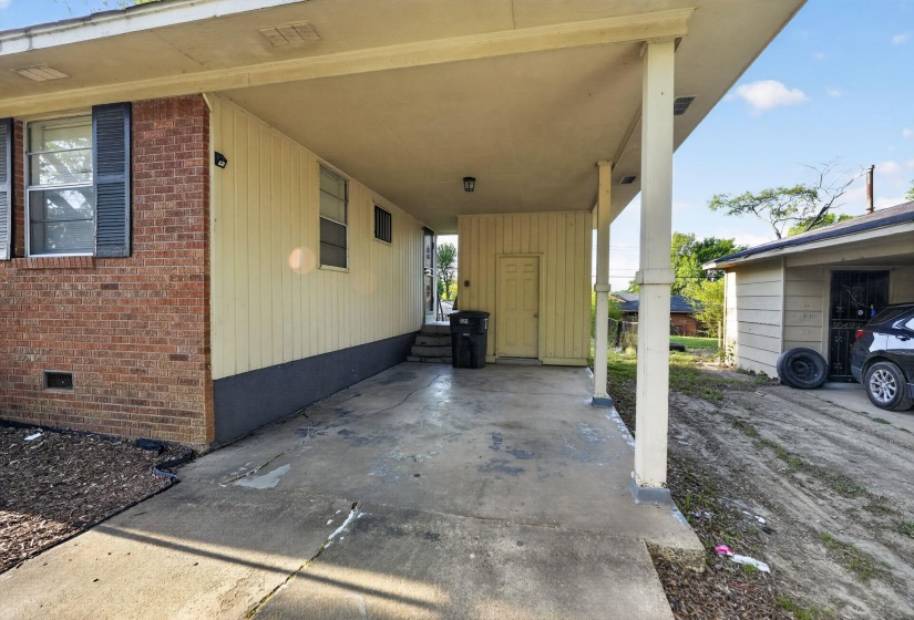 View of patio / terrace featuring an attached carport