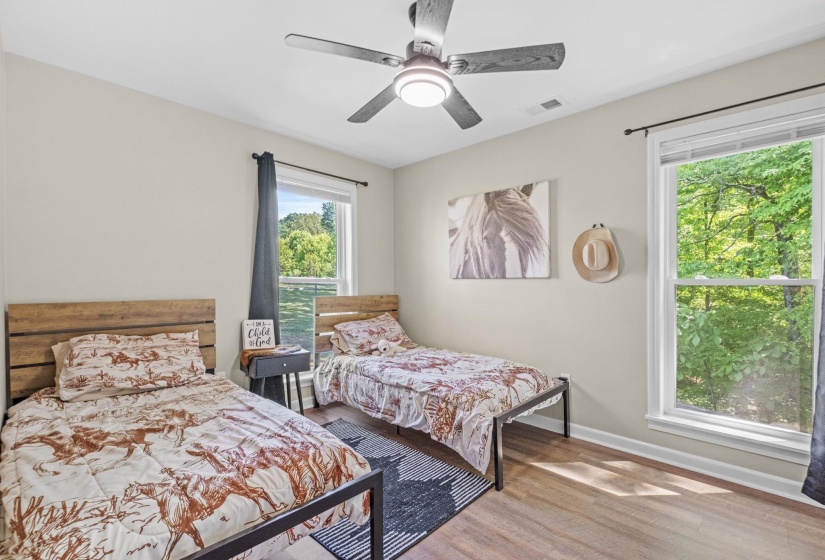 Bedroom featuring light wood-type flooring and ceiling fan