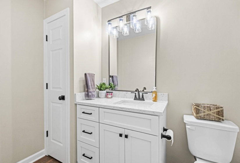 Half bath with vanity and toilet