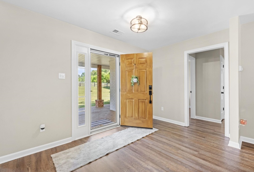 Foyer entrance featuring baseboards and light wood-style floors