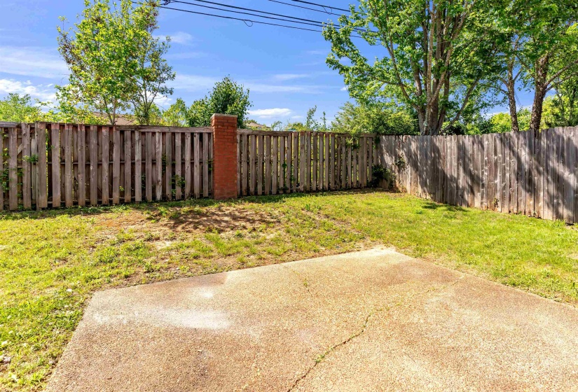 Fenced backyard with a patio area