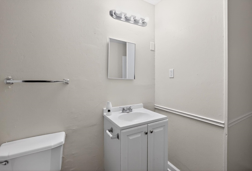 Bathroom featuring vanity and toilet
