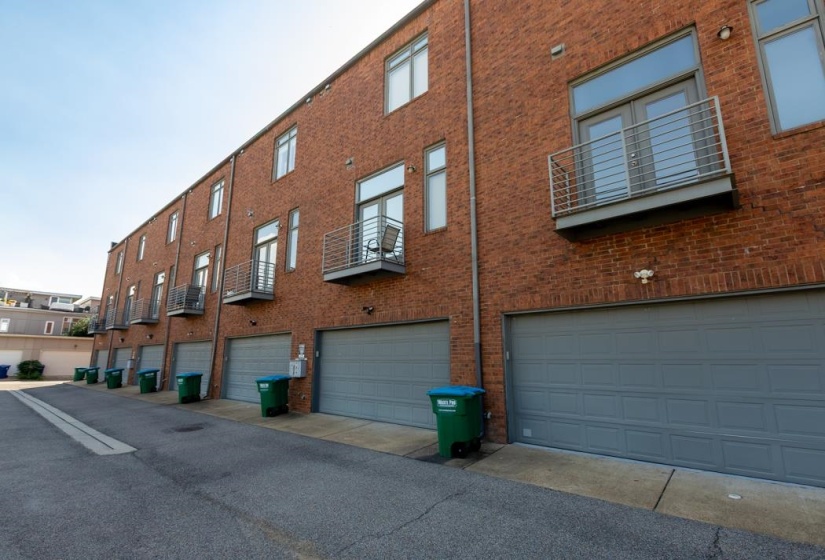 View of building exterior featuring a garage