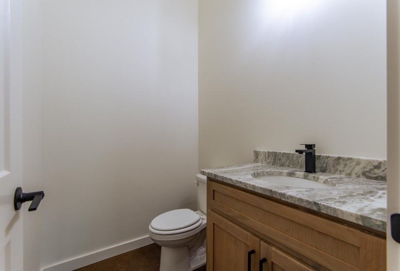 Half bath with vanity and toilet