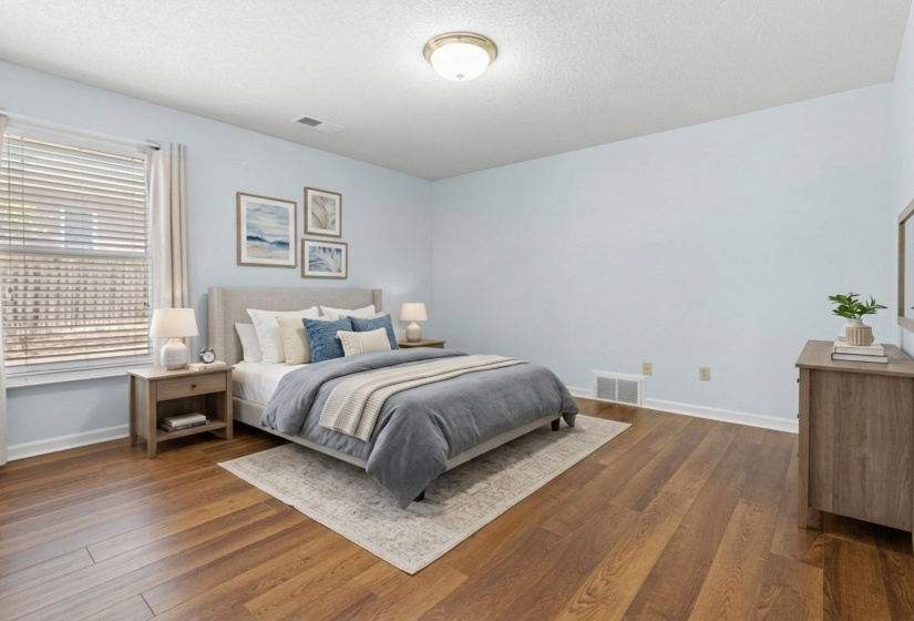Bedroom featuring dark wood-type flooring and a textured ceiling