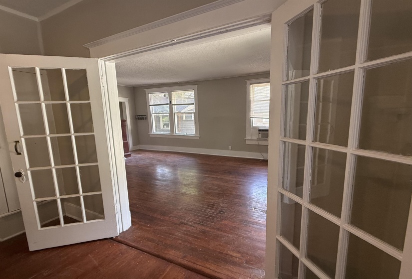 Hall with dark wood finished floors and a textured ceiling