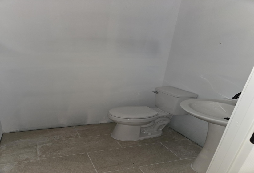 Half bath featuring toilet