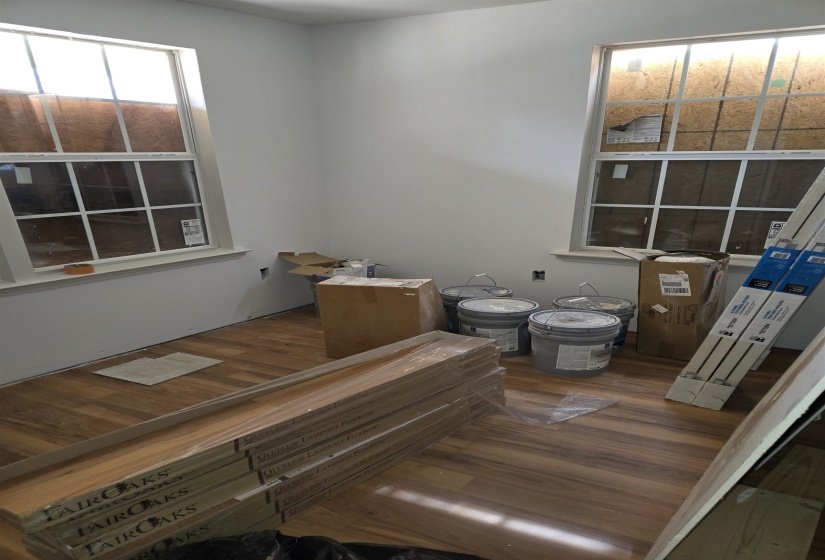 Bathroom featuring toilet and wood finished floors