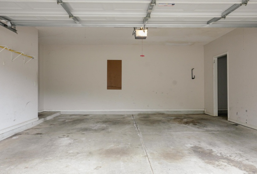 Garage featuring a garage door opener