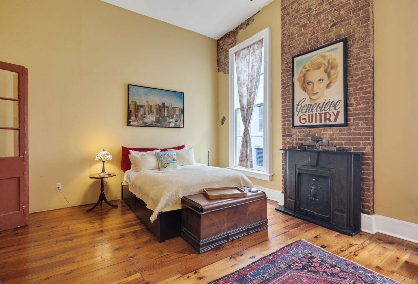 Bedroom with hardwood / wood-style floors