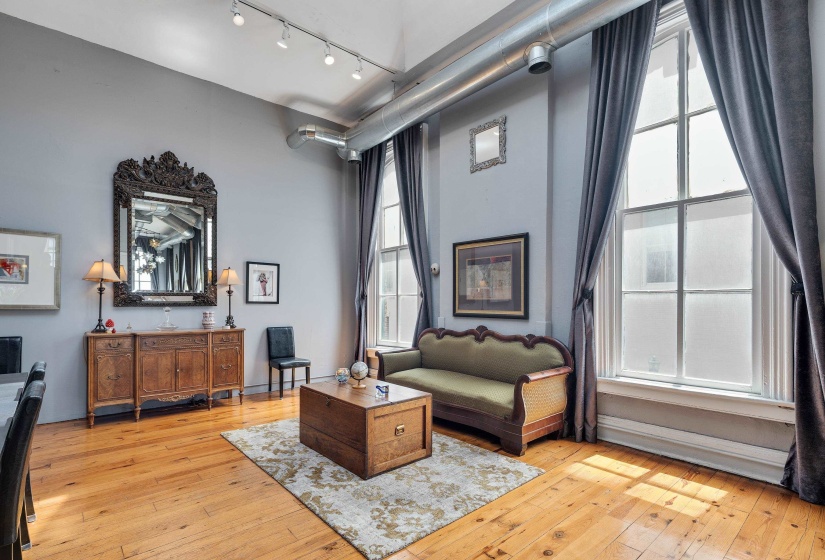 Sitting room featuring light wood-type flooring and rail lighting