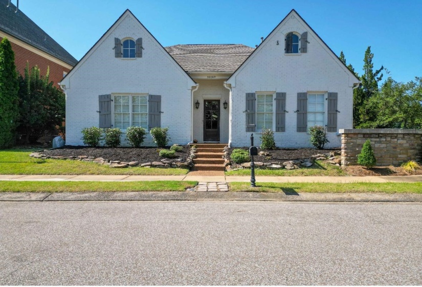 Tudor home with brick siding