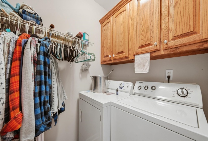 Laundry area featuring cabinet space and independent washer and dryer