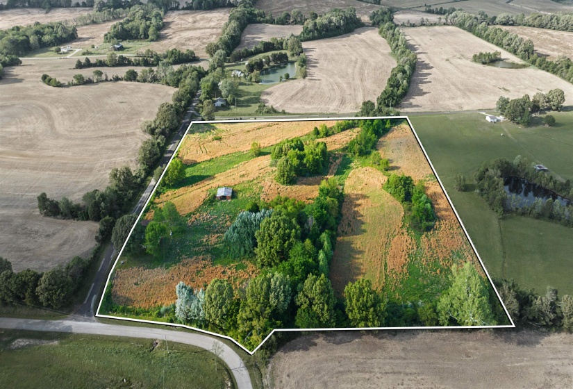 View of rural area with property parcel outlined and abundant farmland