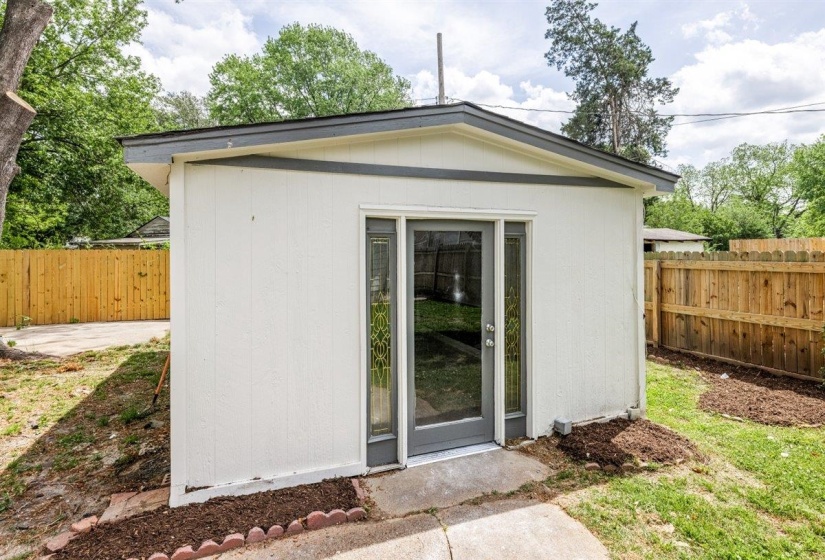 View of shed with a fenced backyard