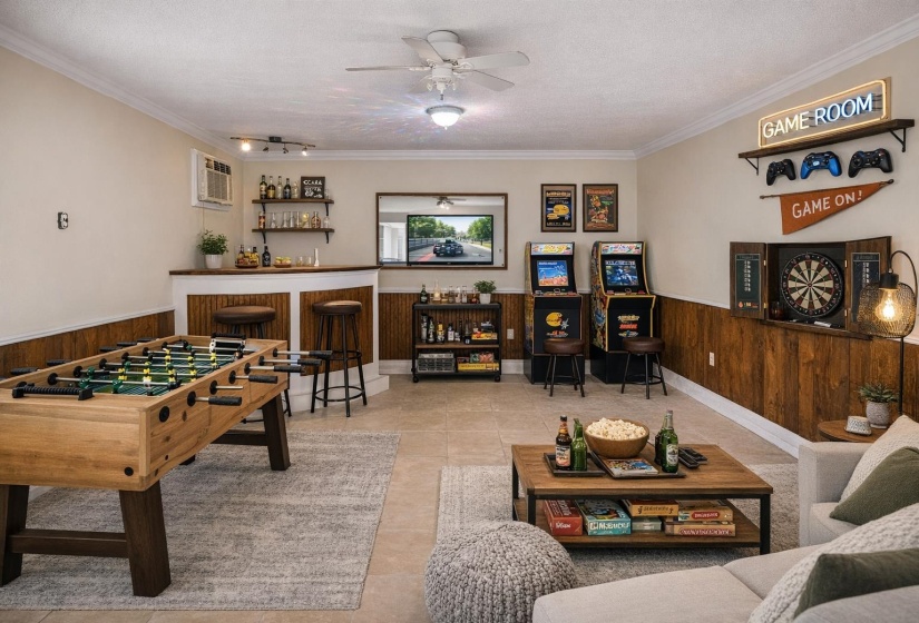 Recreation room featuring a wainscoted wall, wood walls, a dry bar, ceiling fan, and a textured ceiling
