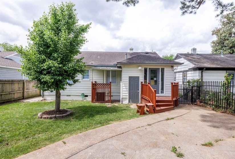 Rear view of house with a fenced backyard