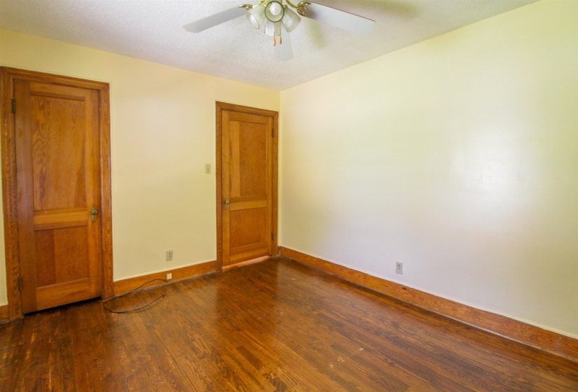 Original Hardwood floors and ceiling fan.