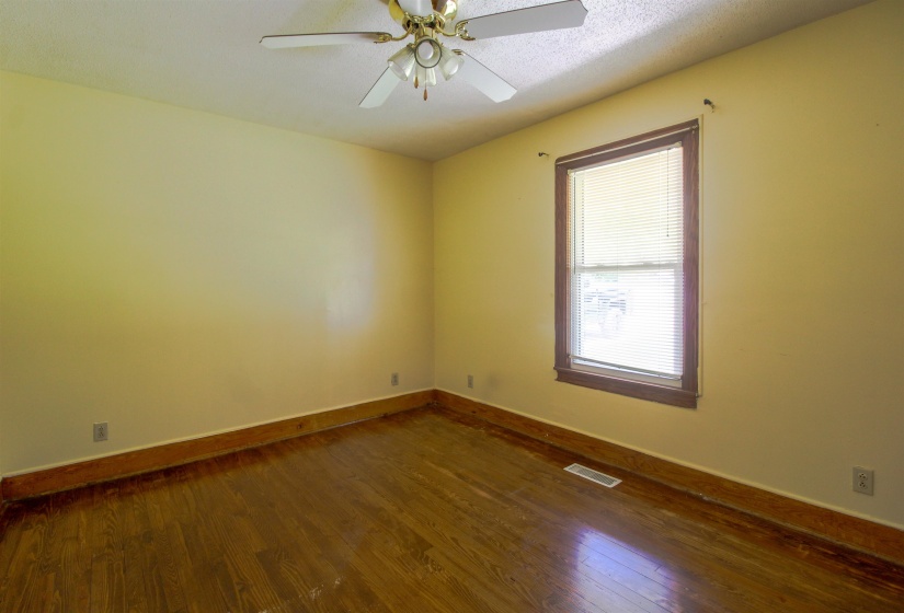 Original Hardwood floors and ceiling fan.