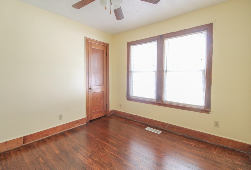 Original Hardwood floors and ceiling fan.