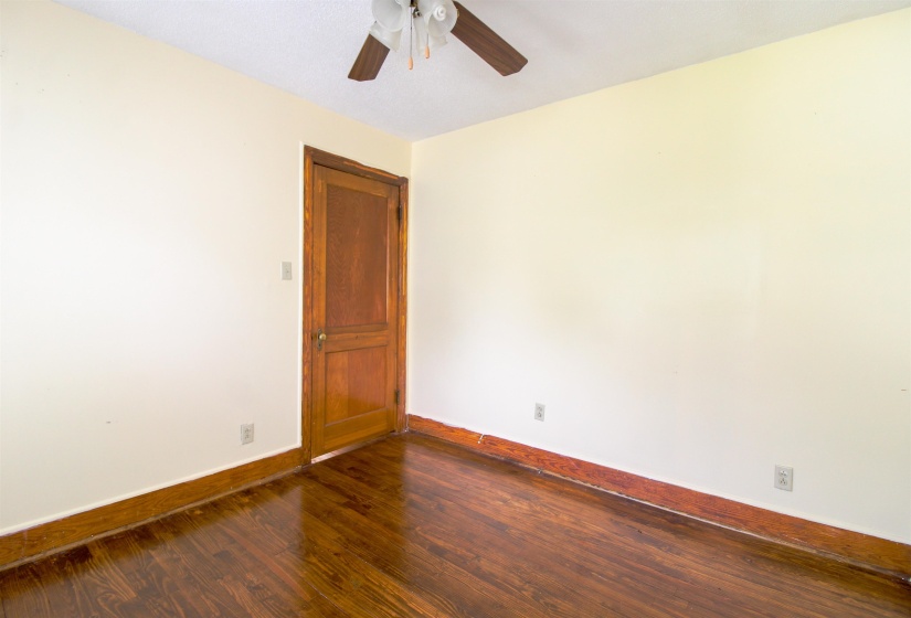 Original Hardwood floors and ceiling fan.