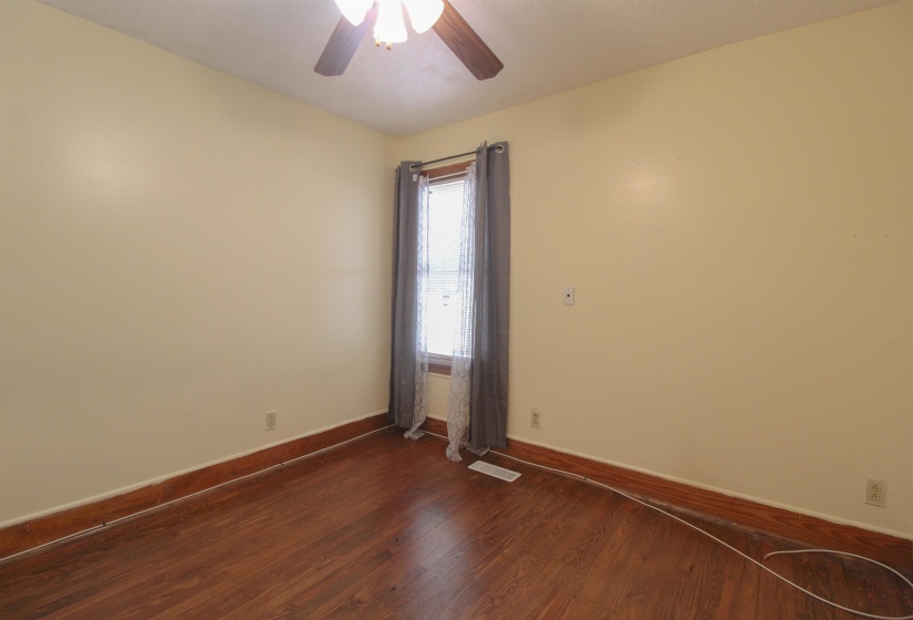 Original Hardwood floors and ceiling fan.