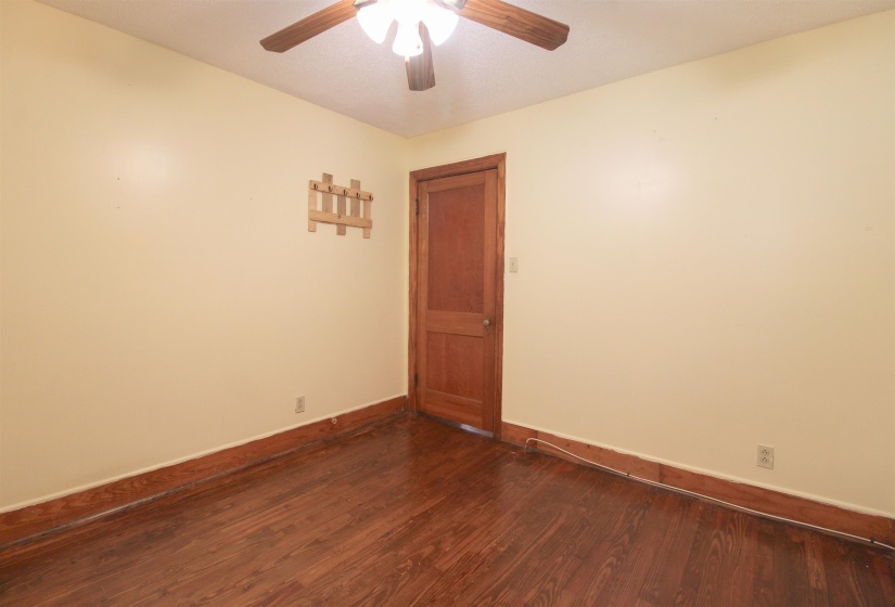 Original Hardwood floors and ceiling fan.