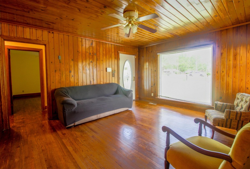 Original Hardwood Floors and huge front window.