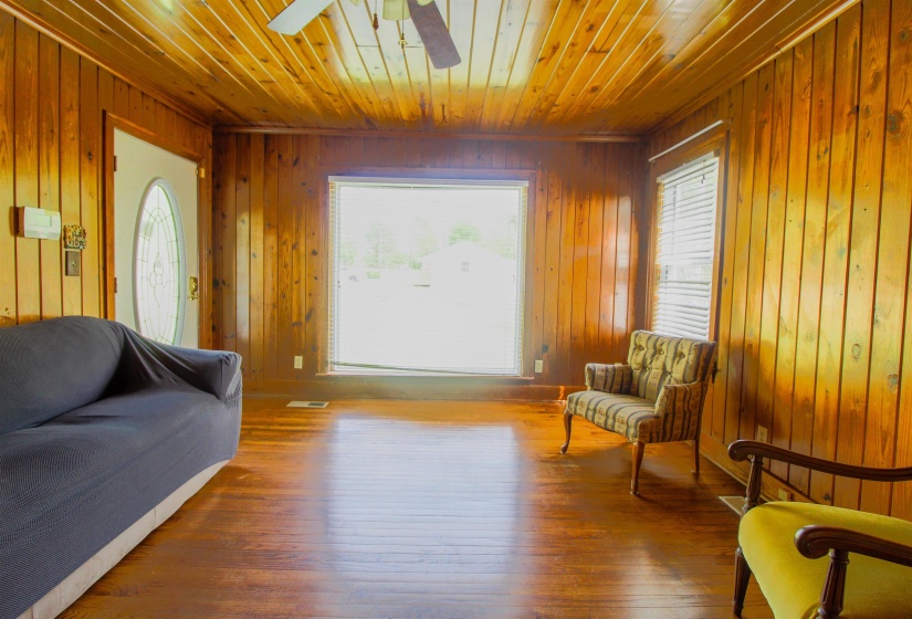 Original Hardwood Floors and huge front window.