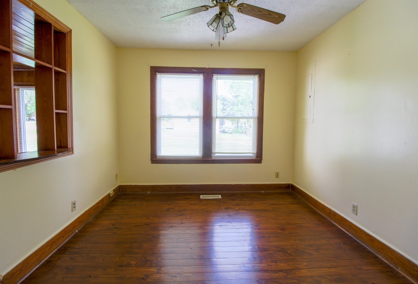 Formal Dining Room featuring dark wood finished floors, ceiling fan, and a textured ceiling